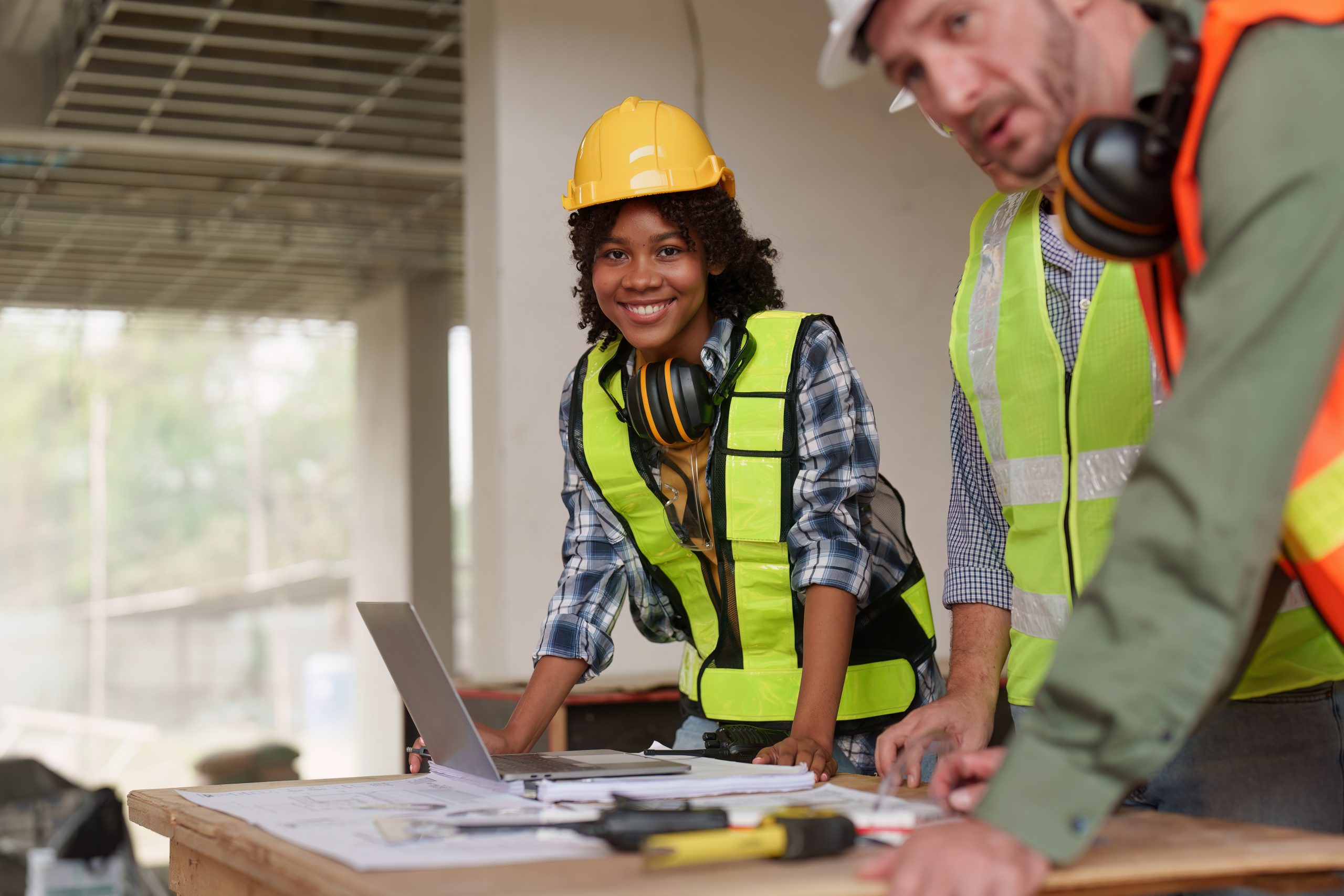 American African Foreman builder woman at construction site. Foreman construction and Engineer working at construction site.