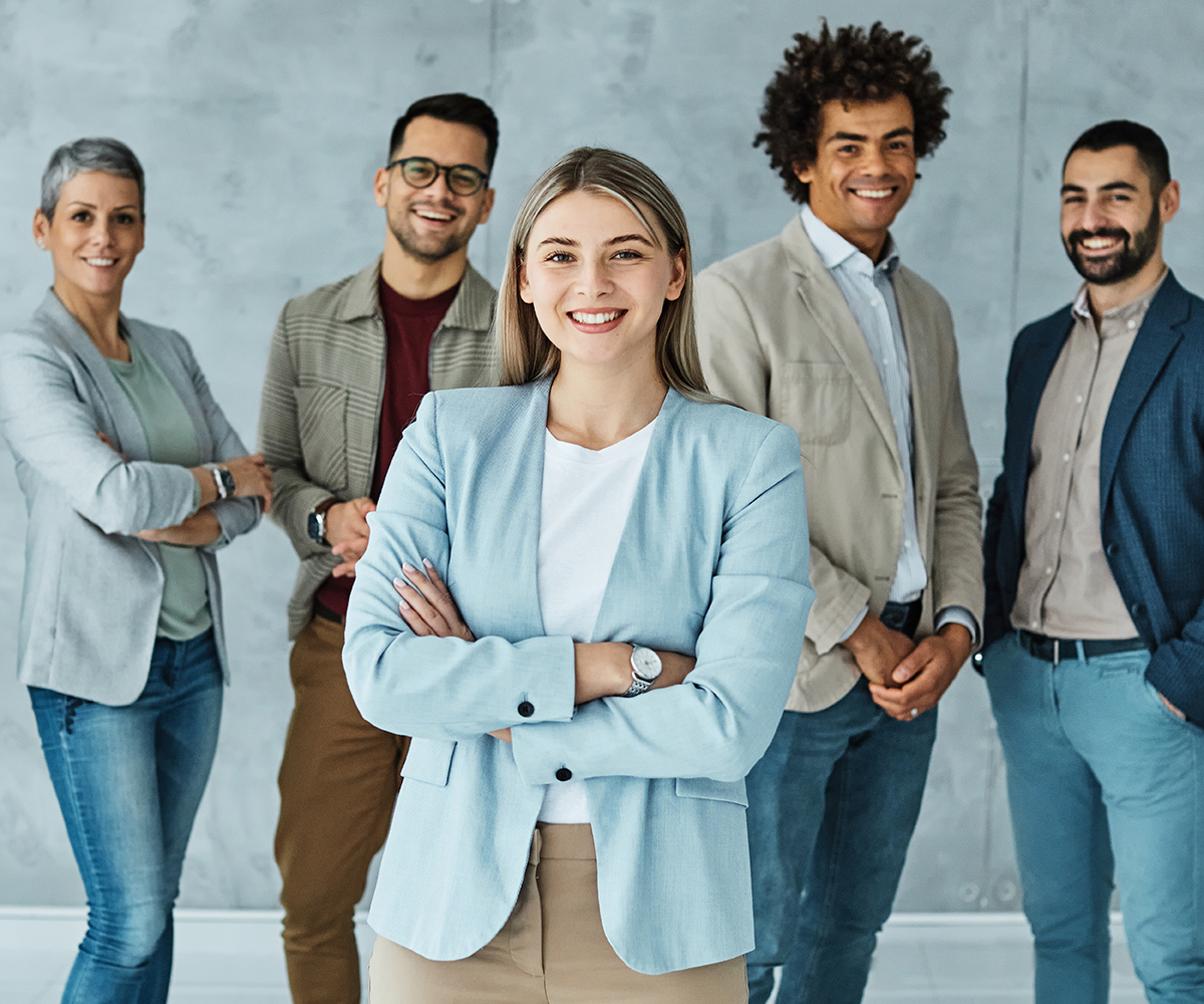 Portrait of a group of young and business people having a meeting in the office. Teamwork and success concept