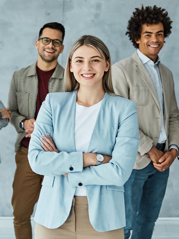 Portrait of a group of young and business people having a meeting in the office. Teamwork and success concept